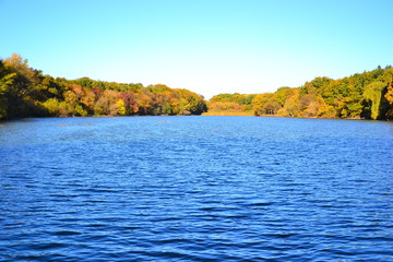  Panorama of a beautiful lake in the forest in autumn. Autumn natural background.