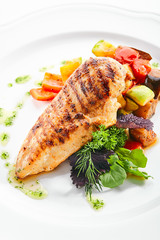 Macro Shot of Grilled Chicken Fillet with Side Dish of Baked Vegetables