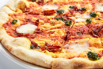 Focaccia with sun dried tomatoes and mozzarella closeup