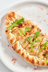 Delicious quesadilla with ham and tomatoes top view