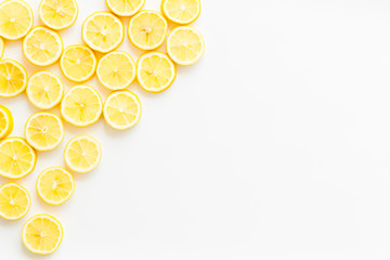 Lemon slices frame on white background top view copy space
