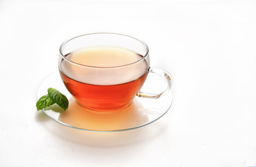 Glass cup of tea isolated on white