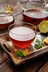 Close up of tea cup on wooden palette in rustic style