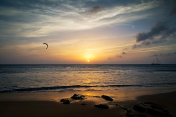 Lonely rider kitesurfing at Los Lances beach at sunset, Tarifa, Cadiz province, Andalusia, Spain