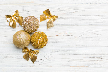 Creative set of New Year baubles and decorations on wooden background. Top view of Christmas time concept. Copy space