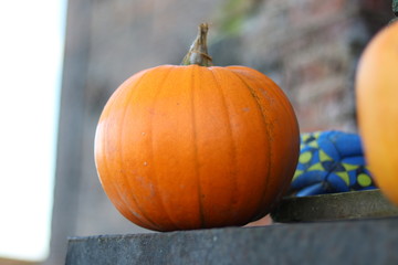 A pumpkin used as decoration on a farm 