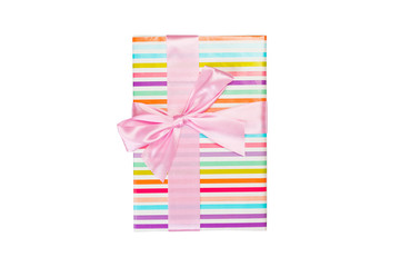Fototapeta premium Christmas or other holiday handmade present in colored paper with pink ribbon. Isolated on white background, top view. thanksgiving Gift box concept