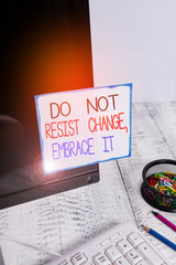 Word writing text Do Not Resist Change Embrace It. Business photo showcasing Be open to changes try new things Positive Note paper taped to black computer screen near keyboard and stationary