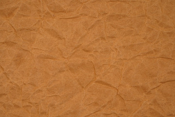 Brown crumpled packaging paper background texture. Kraft Paper Coarse. Wrinkled paper bag