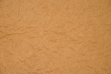 Brown crumpled packaging paper background texture. Kraft Paper Coarse. Wrinkled paper bag