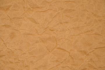 Brown crumpled packaging paper background texture. Kraft Paper Coarse. Wrinkled paper bag