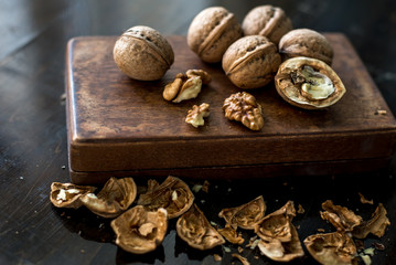 Obraz na płótnie Canvas walnuts and nutcracker on wooden background