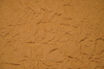 Brown crumpled packaging paper background texture. Kraft Paper Coarse. Wrinkled paper bag