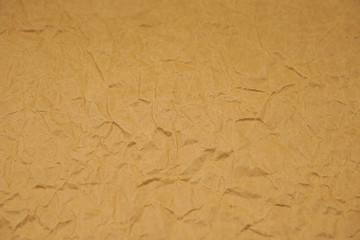 Brown crumpled packaging paper background texture. Kraft Paper Coarse. Wrinkled paper bag