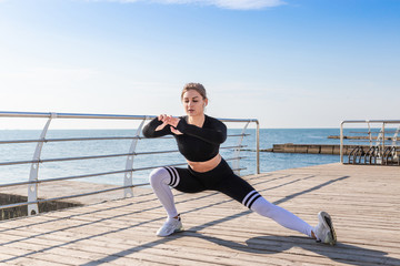 Woman doing stretching exercises after running.