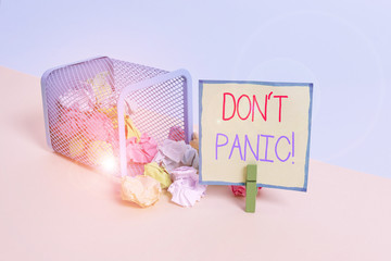 Conceptual hand writing showing Don T Panic. Concept meaning suddenly feel so worried or frightened that you can not behave Trash bin crumpled paper clothespin reminder office supplies