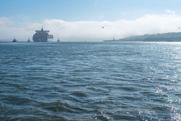 Obraz premium This is a fragment of the port water area during the withdrawal of the container ship