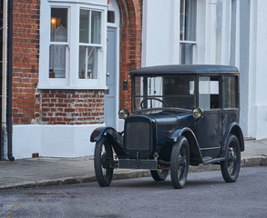Vintage black automobile parked in the street