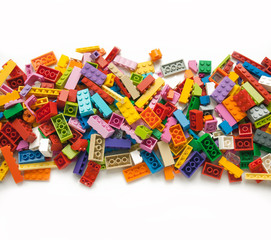 Colorful toy bricks frame with white empty space for your content