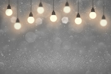 cute shiny glitter lights defocused bokeh abstract background with light bulbs and falling snow flakes fly, festive mockup texture with blank space for your content