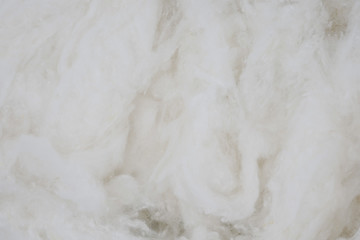 White cotton texture is soft, fluffy wadding background closeup