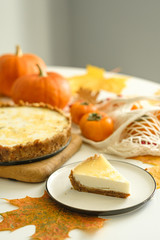 pumpkin cheesecake with persimmon. autumn concept.