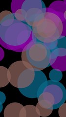 Multicolored translucent circles on a dark background. 3D illustration