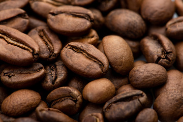 Coffee beans close-up background. Fresh roasted