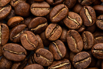 Coffee beans close-up background. Fresh roasted
