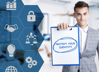 Business, technology, internet and network concept. Young businessman shows a keyword: Protect your identity