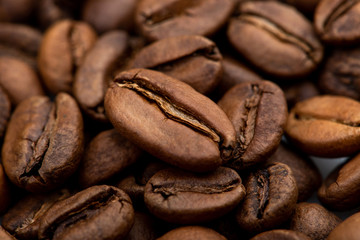 Coffee beans close-up background. Fresh roasted