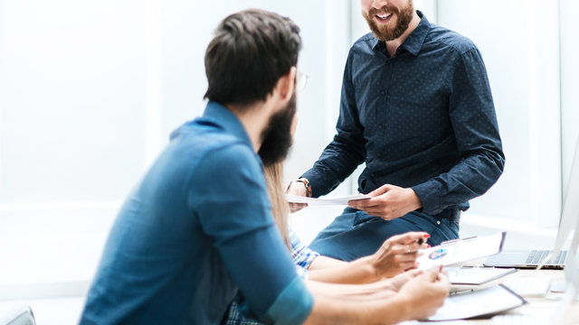 business team is discussing something at the workplace in the office