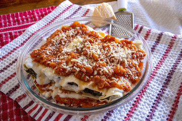Cannelloni are a cylindrical type of lasagna generally served baked with a filling and covered by a sauce in Italian cuisine. Popular stuffings include spinach and ricotta or minced beef. Italian food
