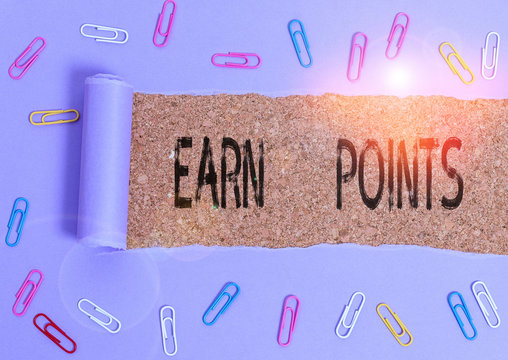 Word writing text Earn Points. Business photo showcasing getting praise or approval for something you have done Paper clip and torn cardboard placed above a wooden classic table backdrop