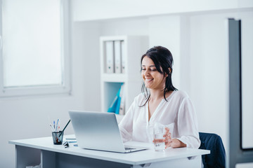 Young woman in office