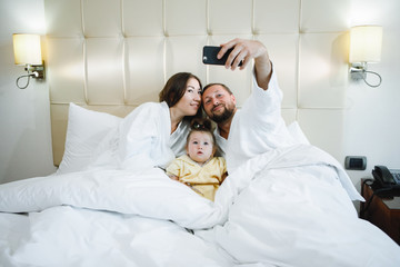 Obraz na płótnie Canvas Family in bed.