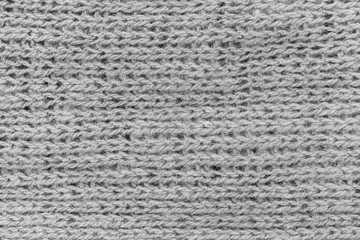 White natural texture of knitted wool textile material background. White cotton fabric woven canvas texture