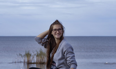 Happy girl on the background of the Bay