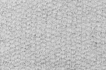 White natural texture of knitted wool textile material background. White cotton fabric woven canvas texture