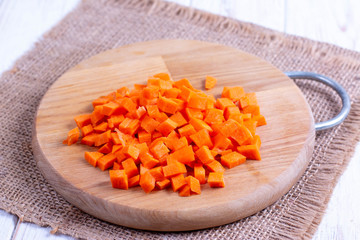 Cubes of carrots on a cutting board