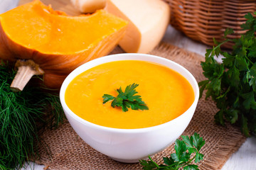 Pumpkin puree with cheese in a white bowl