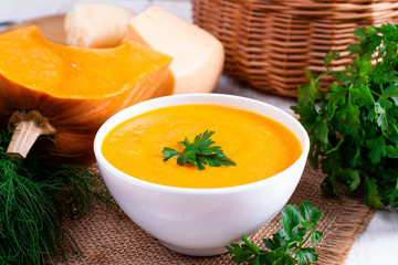 Pumpkin puree with cheese in a white bowl