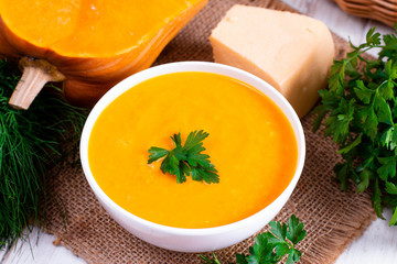 Pumpkin puree with cheese in a white bowl