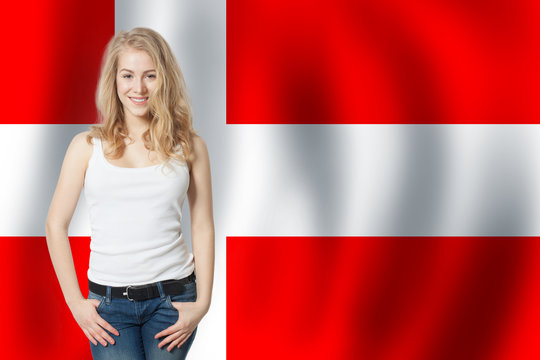 Travel and learn danish language concept. Smiling woman student with Denmark flag background