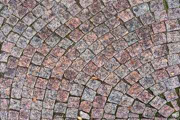 Old city pavement. Natural stone background.