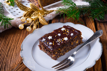 Fototapeta na wymiar Christmas poppy cake with chocolate.