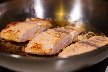 Salmon steak. Raw meat. Mediterranean diet. Cooking in a restaurant. Fried sea fish. Organic food. Side dish of vegetables and cream sauce