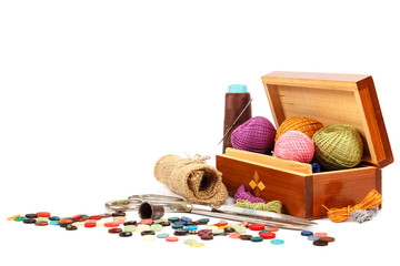 Thread, buttons, scissors on white background. Sewing supplies. 