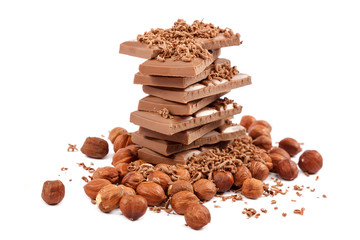 Chocolate tiles and nuts on white background