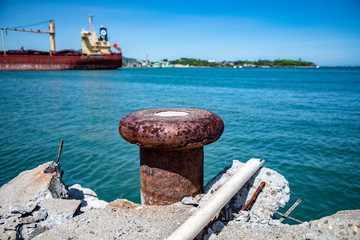 Old rusty ruined caribbean port, bollard, bitt, Puerto Plata harbor, Dominican Republic